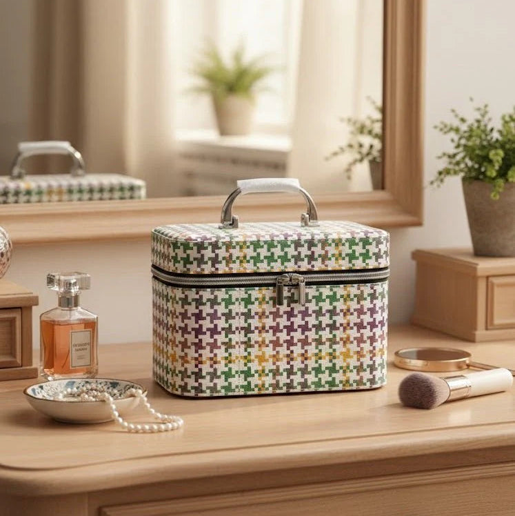 Multicolored patterned makeup case on a wooden dresser with a mirror and decorative items.